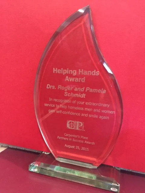Helping Hands Award for Drs. Roger and Pamela Schmidt